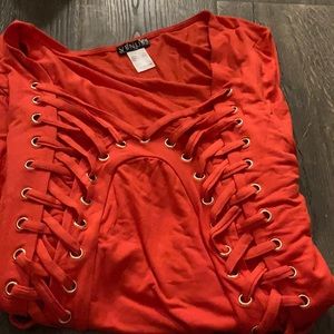Red top with shoelace pattern